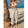 image:imageDokotoo Beach Pants for Womens Vacation Summer Outfits Smocked Waist Harem Boho Flowy Wide Leg Hippie Pants with PocketsParchment
