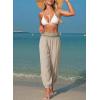 image:imageDokotoo Beach Pants for Womens Vacation Summer Outfits Smocked Waist Harem Boho Flowy Wide Leg Hippie Pants with PocketsParchment