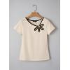 image:imageDokotoo Womens Tops Summer Short Sleeve Crew Neck Slim Fitted Blouse Trendy Cut Out Floral Pattern Basic Tees ShirtsApricot