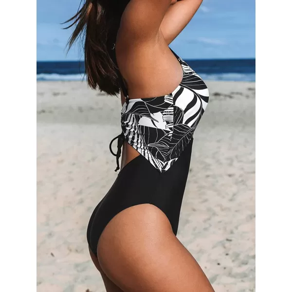imageCUPSHE One Piece Swimsuit for Women Bathing Suit Cutout Tummy Control Back Drawstring Adjustable StrapsBlackTropical Leaf