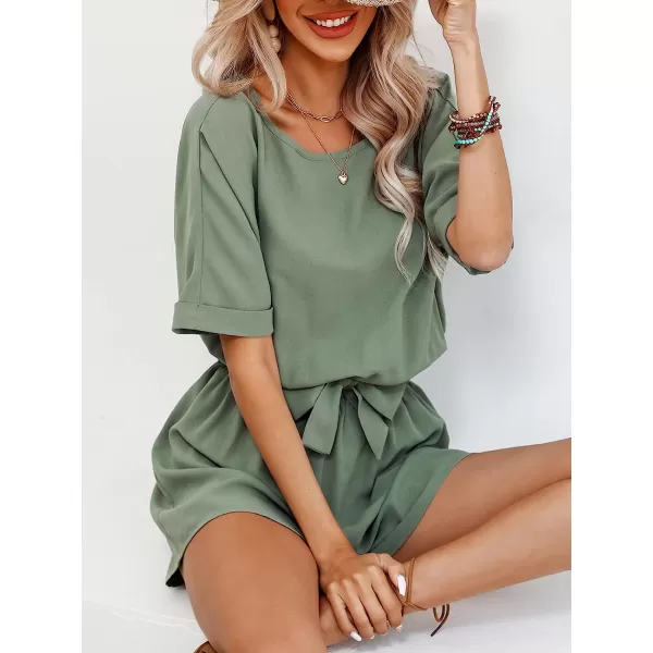 imageCUPSHE Womens Boat Neck Romper Short Sleeves Jumpsuit Empire Waist Belt Romper with Back CutoutGreen