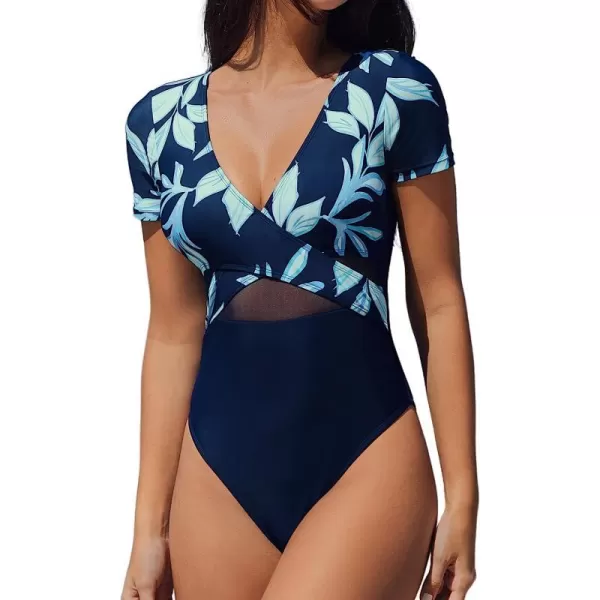 imageCUPSHE One Piece Swimsuit for Women Bathing Suit Mesh V Neck Front Cross Wrapped High CutNavy and Tropical Print