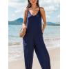 imageCUPSHE Womens Casual V Neck Spaghetti Straps Jumpsuit Sleeveles Baggy Long Pants Overall Outfit with PocketsBlue