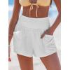 imageCUPSHE Women Coverup Shorts Smocked Waist High Rise Swimsuit Coverup Shorts with Side PocketsWhite