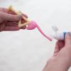 imageDr Browns ToothScrubber Toothbrush ThreeSided Toddler Training Toothbrush for Ages 14 Years with Suction Cup Base and Color Changing Bristles2 Pack  Toddler Toothbrush  Purple Monster  Flamingo