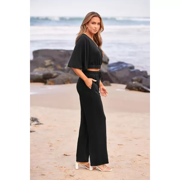 imagePRETTYGARDEN 2 Piece Outfits for Women 2023 Summer Short Sleeve Wrap V Neck Crop Tops Wide Leg Pants SetBlack