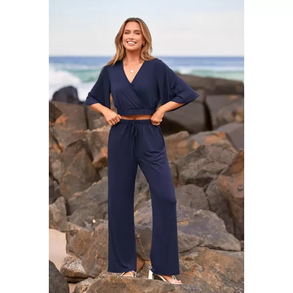 imagePRETTYGARDEN 2 Piece Outfits for Women 2023 Summer Short Sleeve Wrap V Neck Crop Tops Wide Leg Pants SetNavy