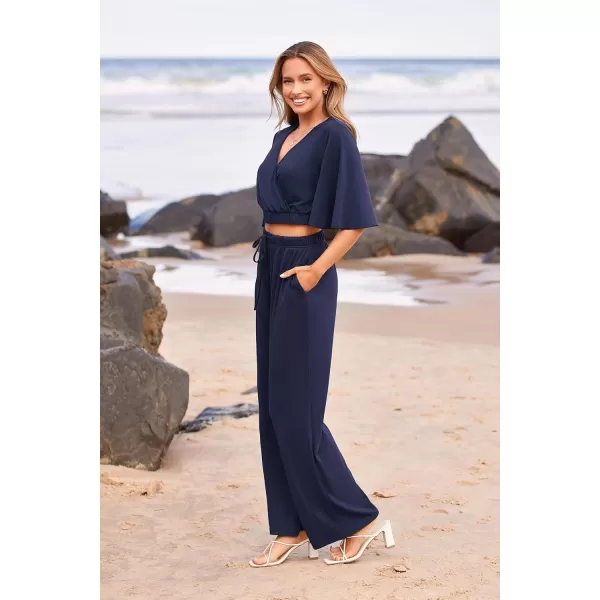 imagePRETTYGARDEN 2 Piece Outfits for Women 2023 Summer Short Sleeve Wrap V Neck Crop Tops Wide Leg Pants SetNavy