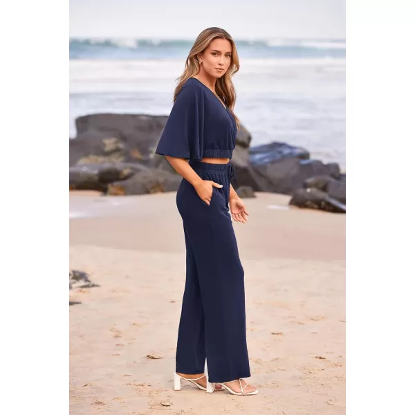 imagePRETTYGARDEN 2 Piece Outfits for Women 2023 Summer Short Sleeve Wrap V Neck Crop Tops Wide Leg Pants SetNavy