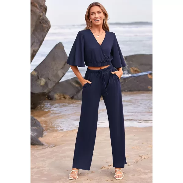 imagePRETTYGARDEN 2 Piece Outfits for Women 2023 Summer Short Sleeve Wrap V Neck Crop Tops Wide Leg Pants SetNavy