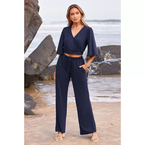 imagePRETTYGARDEN 2 Piece Outfits for Women 2023 Summer Short Sleeve Wrap V Neck Crop Tops Wide Leg Pants SetNavy