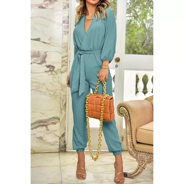 imagePRETTYGARDEN Womens 2023 Fall Jumpsuits Casual Dressy One Piece Outfits V Neck Long Sleeve Belt Pockets Long Pants RomperBlue Green