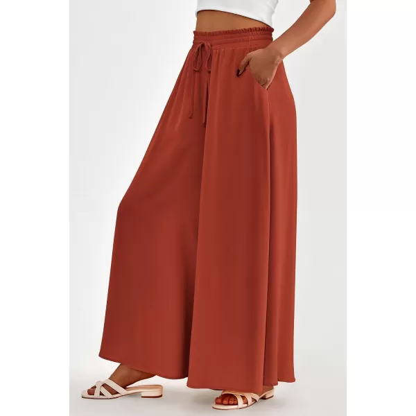 imagePRETTYGARDEN Womens 2024 Summer Wide Leg Palazzo Pants High Waisted Flowy Pockets Trendy Casual Lounge Boho Beach TrousersBrick Red