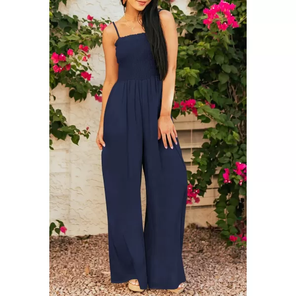 imagePRETTYGARDEN Womens Summer Jumpsuits Dressy Casual One Piece Outfits Linen Smocked Spaghetti Strap Pockets Wide Leg RompersNavy