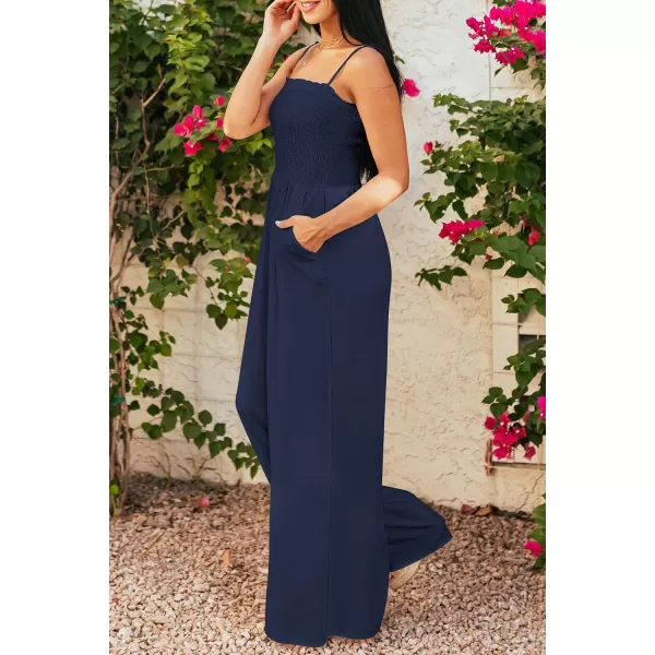 imagePRETTYGARDEN Womens Summer Jumpsuits Dressy Casual One Piece Outfits Linen Smocked Spaghetti Strap Pockets Wide Leg RompersNavy