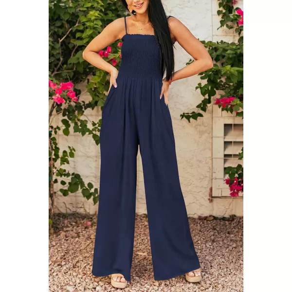 imagePRETTYGARDEN Womens Summer Jumpsuits Dressy Casual One Piece Outfits Linen Smocked Spaghetti Strap Pockets Wide Leg RompersNavy