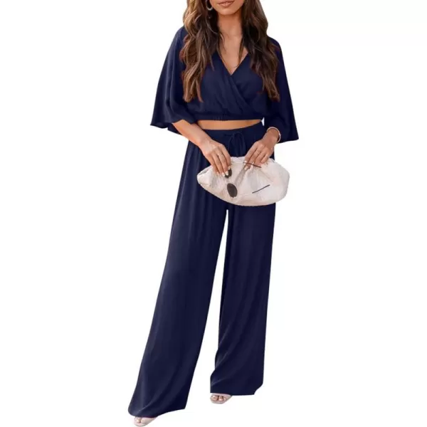imagePRETTYGARDEN 2 Piece Outfits for Women 2023 Summer Short Sleeve Wrap V Neck Crop Tops Wide Leg Pants SetNavy