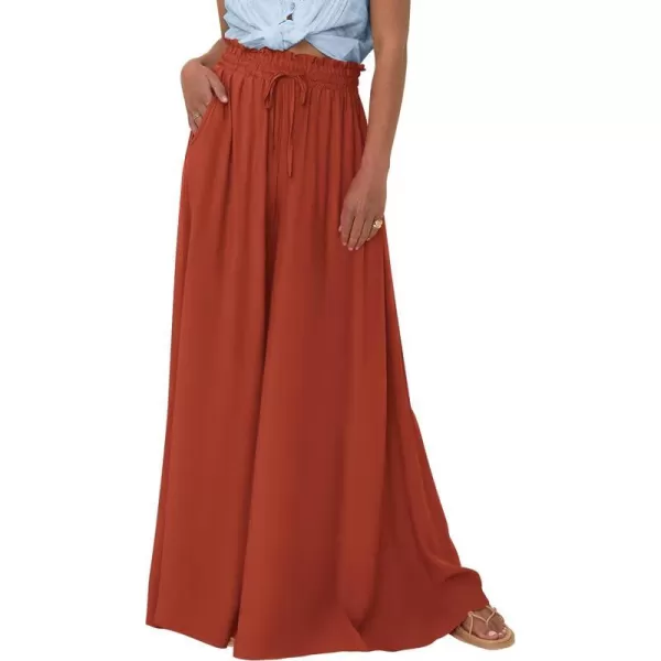 imagePRETTYGARDEN Womens 2024 Summer Wide Leg Palazzo Pants High Waisted Flowy Pockets Trendy Casual Lounge Boho Beach TrousersBrick Red
