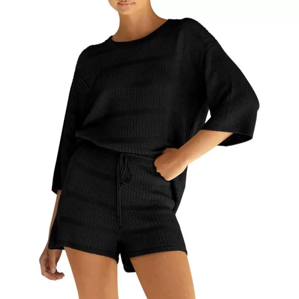 imagePRETTYGARDEN Womens Two Piece Outfits Summer Hollow Out Knit Lounge Sets Half Sleeve Tops Blouses and Shorts TracksuitBlack