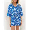 imagePRETTYGARDEN Womens Rompers for Summer 2025 Beach Vacation Clothes Short Sleeves Floral Jumpsuits Beach Cover UpBlue