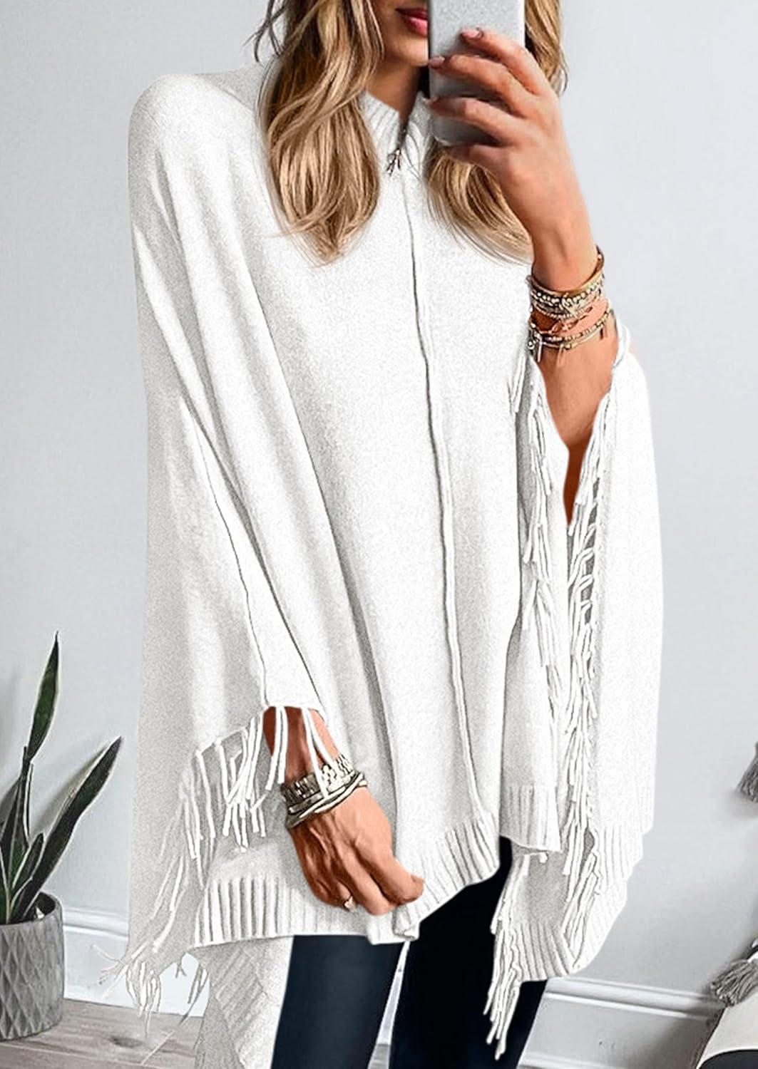 imagePRETTYGARDEN Womens 2025 Fall Winter Poncho Sweaters Trendy Chunky Knit Fringe Shawls Wraps Pullover Tops Holiday OutfitsWhite